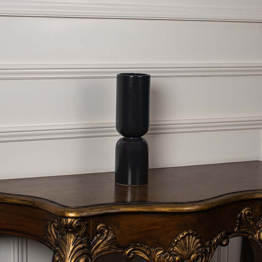 Tall black sculptural ceramic vase shown on a plain white background perfect for consoles shelves and elegant minimal home decor.