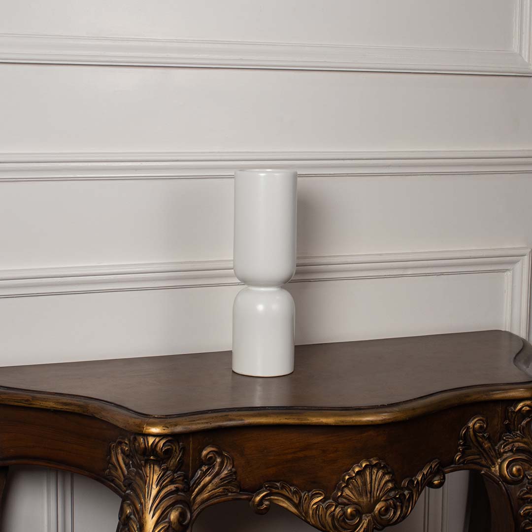 Minimalist matte white stacked ceramic totem vase displayed on a classic wooden console table for an elegant home decor.