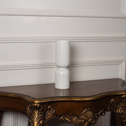 Minimalist matte white stacked ceramic totem vase displayed on a classic wooden console table for an elegant home decor.