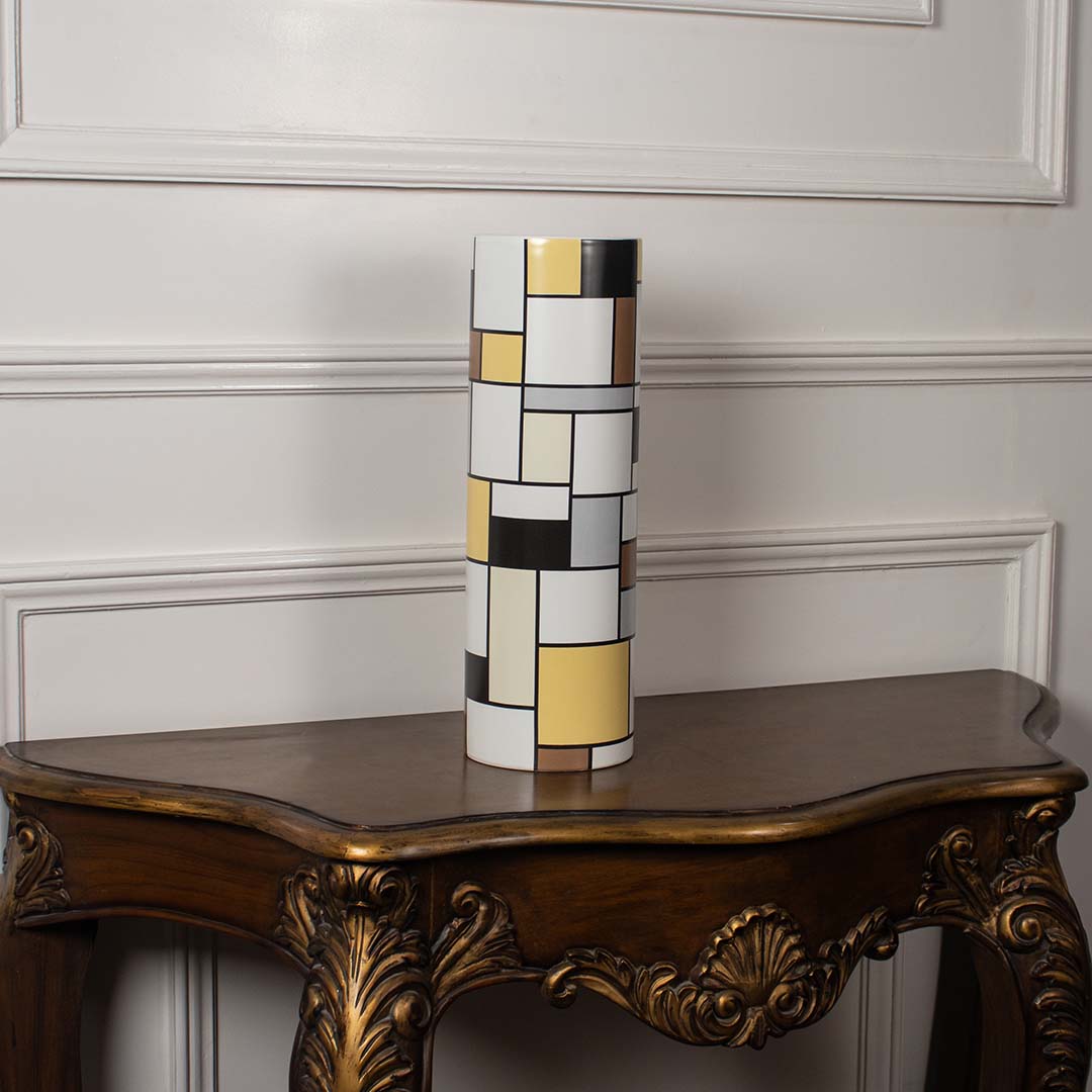White ceramic sculptural vase displayed on a clean background emphasizing its modern fluid form for elegant interior styling.