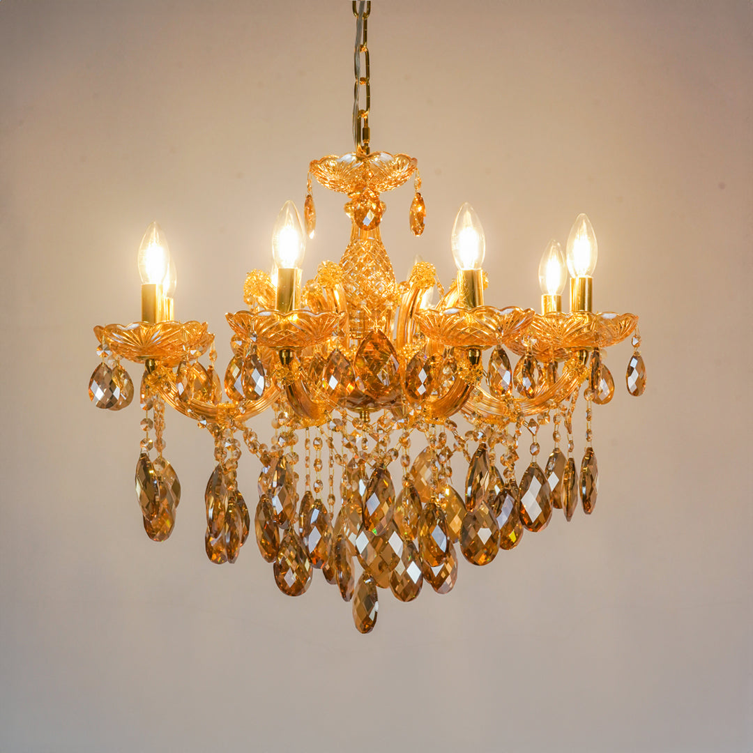 White background image of large venetian crystal chandelier for modern living room decor styling with a bright warm glow.