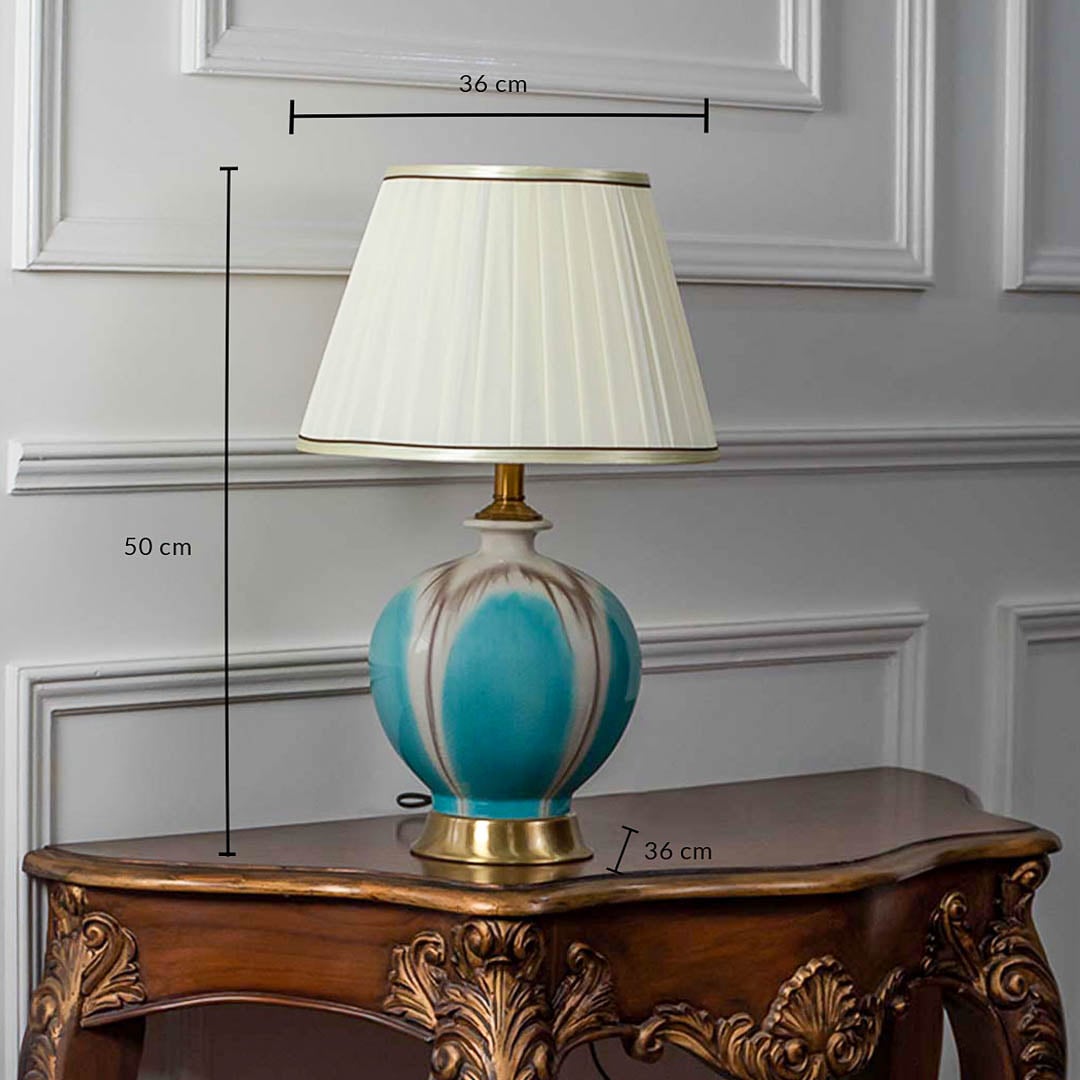Turquoise ceramic table lamp with pleated white shade shown with size 50cm height and 36cm width on white background for product details.