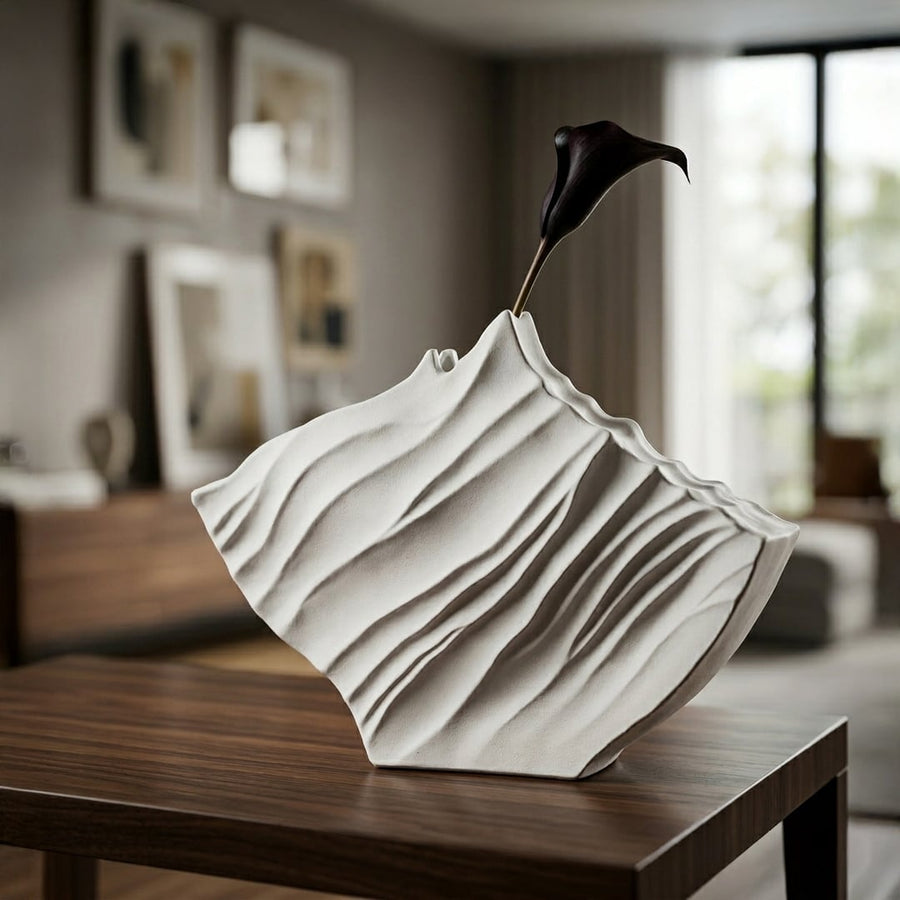 White ceramic abstract flower vase placed on wooden table modern decorative vase for living room corner home decor styling.