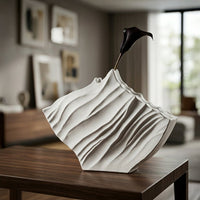 White ceramic abstract flower vase placed on wooden table modern decorative vase for living room corner home decor styling.