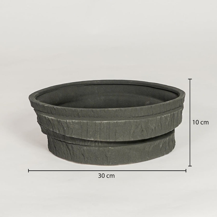 Black ceramic decorative serving bowl showing 30 cm diameter and 10 cm height ideal for dining table centerpiece and kitchen decor display.
