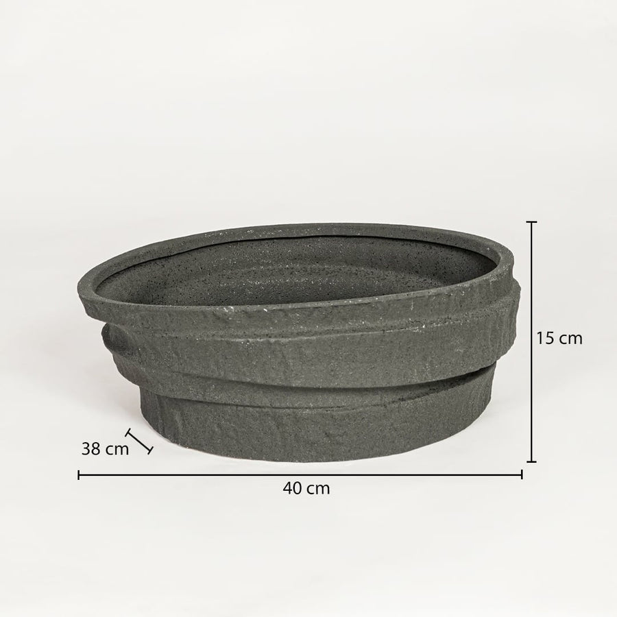 Black ceramic decorative serving bowl showing 40 cm length 38 cm width and 15 cm height ideal for dining table centerpiece decor.