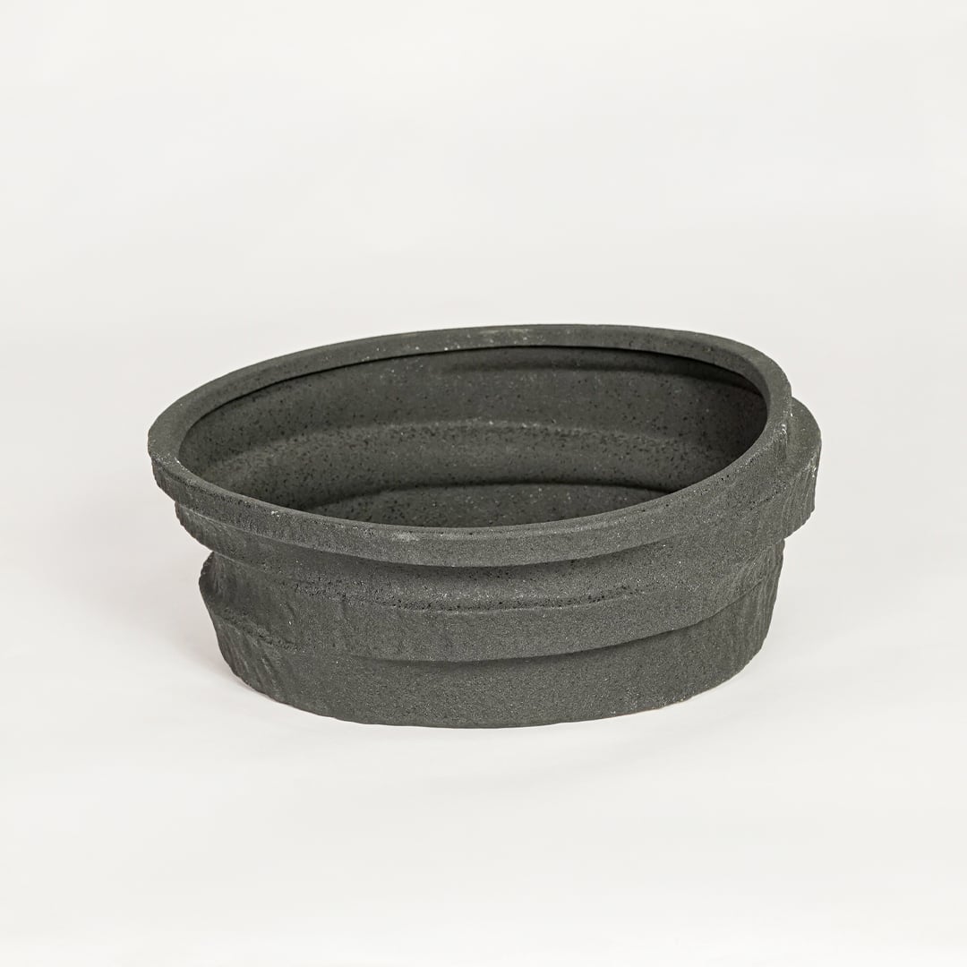 Modern black ceramic decorative serving bowl ideal for fruit display on dining table centerpiece and stylish home decor.