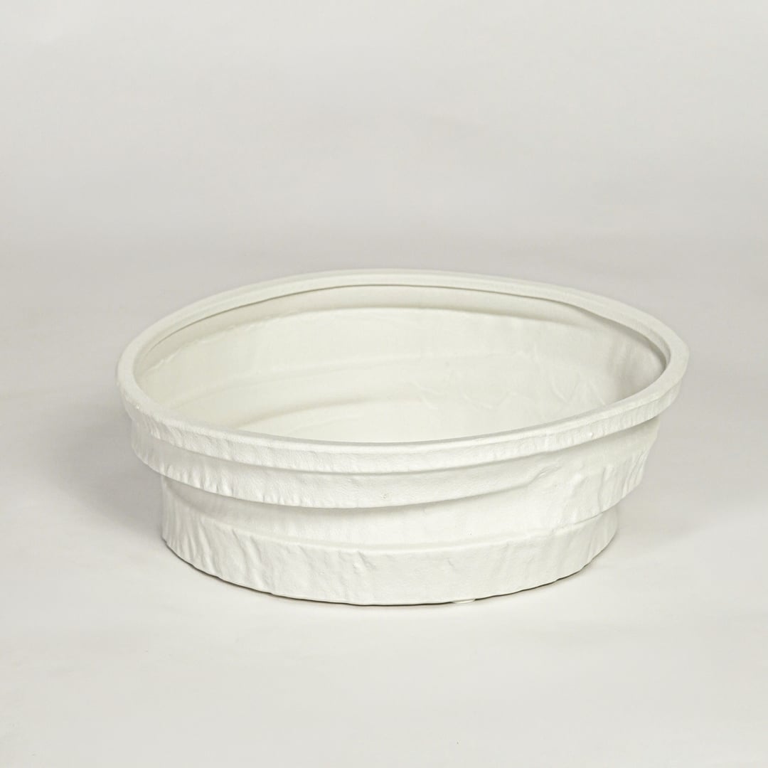 White ceramic round decorative tray with textured rim and smooth interior isolated on clean white background for modern decor styling.