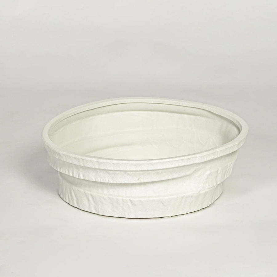 White ceramic round decorative tray with textured rim and smooth interior isolated on clean white background for modern decor styling.