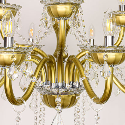 Closeup of gold metal chandelier arms and crystal drops showing fine detailing for premium home lighting.