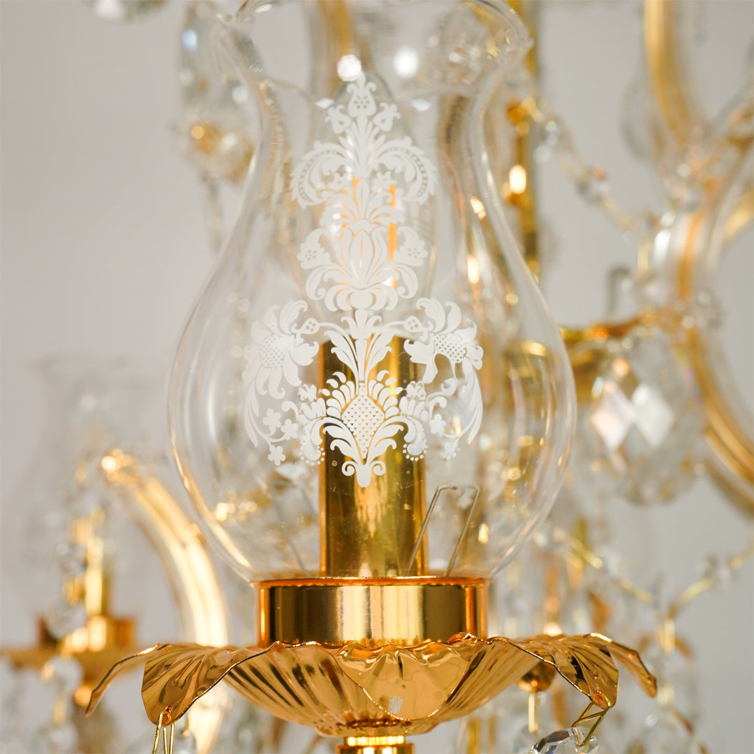 Closeup image of antique style clear glass chandelier for modern dining room decor styling with beautiful glass details.