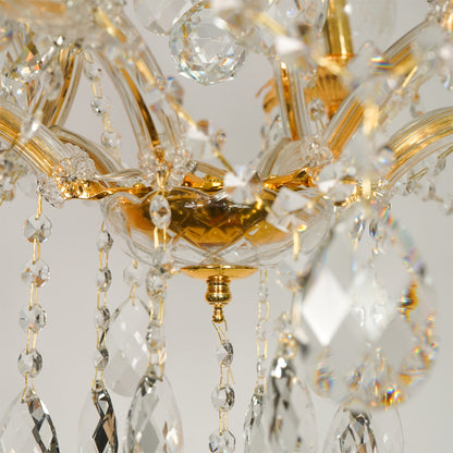 Closeup image of antique style clear glass chandelier for luxury living room decor styling with elegant vintage finish.