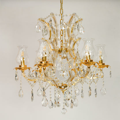 White background image of antique style clear glass chandelier for elegant dining room decor styling with unlit glass arms.