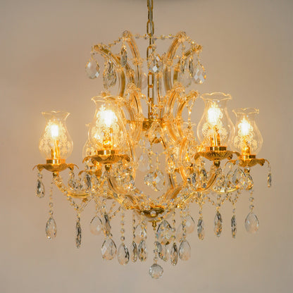 White background image of antique style clear glass chandelier for modern living room decor styling with bright lighting.