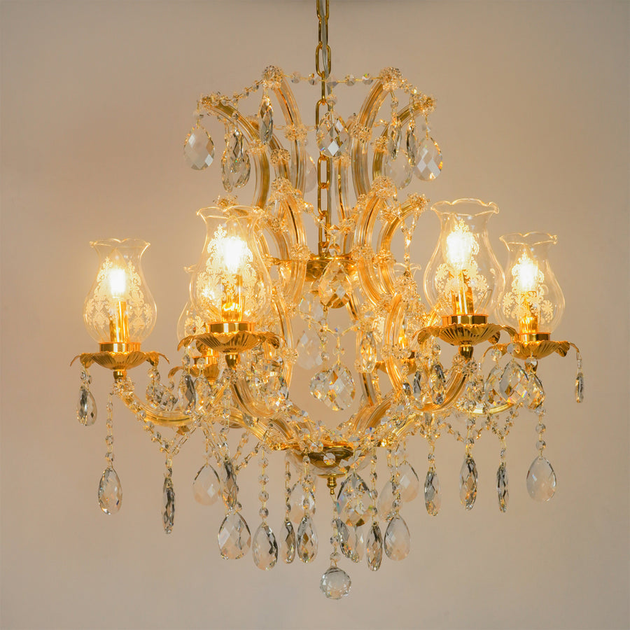 White background image of antique style clear glass chandelier for modern living room decor styling with bright lighting.