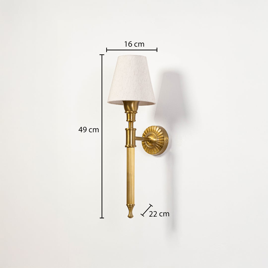 Elegant brass wall sconce with white fabric shade measuring 49cm height 16cm width and 22cm depth specifications shown.