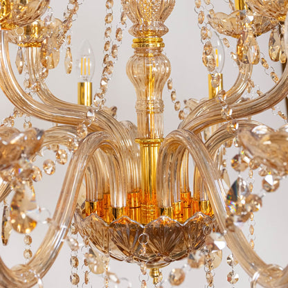 Closeup of golden chandelier with crystal accents showing elegant detailing for luxury decorative lighting.