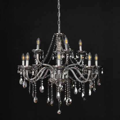 Chandelier with smoky crystal and silver finish displayed off against black background for stylish interior style.