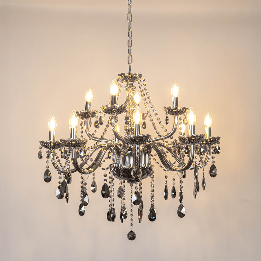 Black crystal chandelier with sparkling crystal accents and warm candle bulbs offering elegant ambient lighting for interiors.