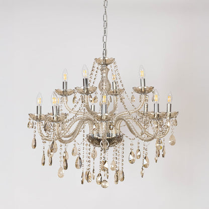 Classic chandelier with golden accents and crystal detailing displayed off on white background for luxury decor.