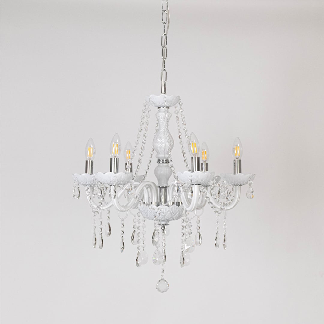 Classic white chandelier with crystal accents displayed off on white background for modern luxury home lighting.