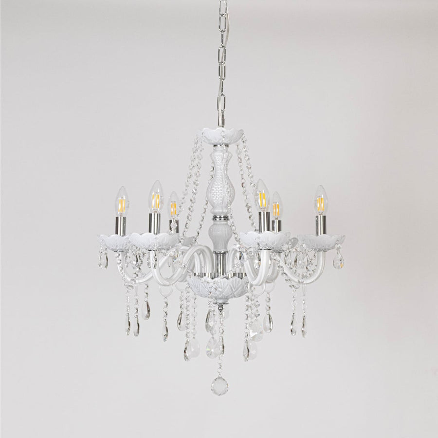 Classic white chandelier with crystal accents displayed off on white background for modern luxury home lighting.