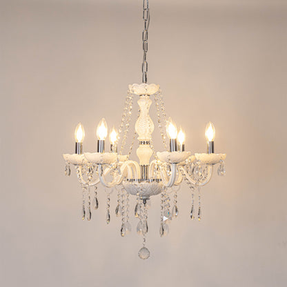 White crystal chandelier with illuminated candle bulbs and cascading crystal details creating timeless luxury ceiling lighting.