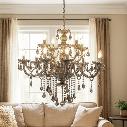 Black chandelier with crystal accents glowing warmly above a sofa and wall art in a cozy living room space.