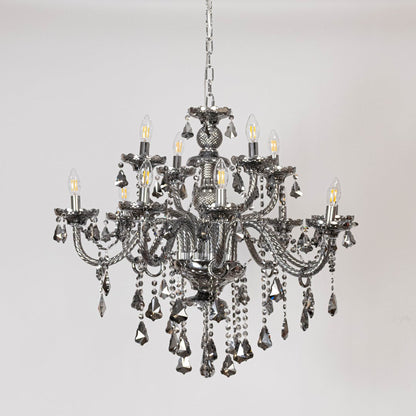 Black chandelier with lights off showing decorative arms and crystal chains on plain white background.
