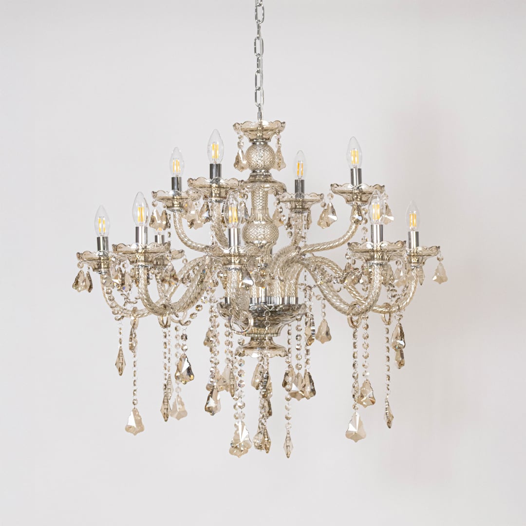 Chandelier with lights off showing crystal hanging design and detailed glass body on plain white background.