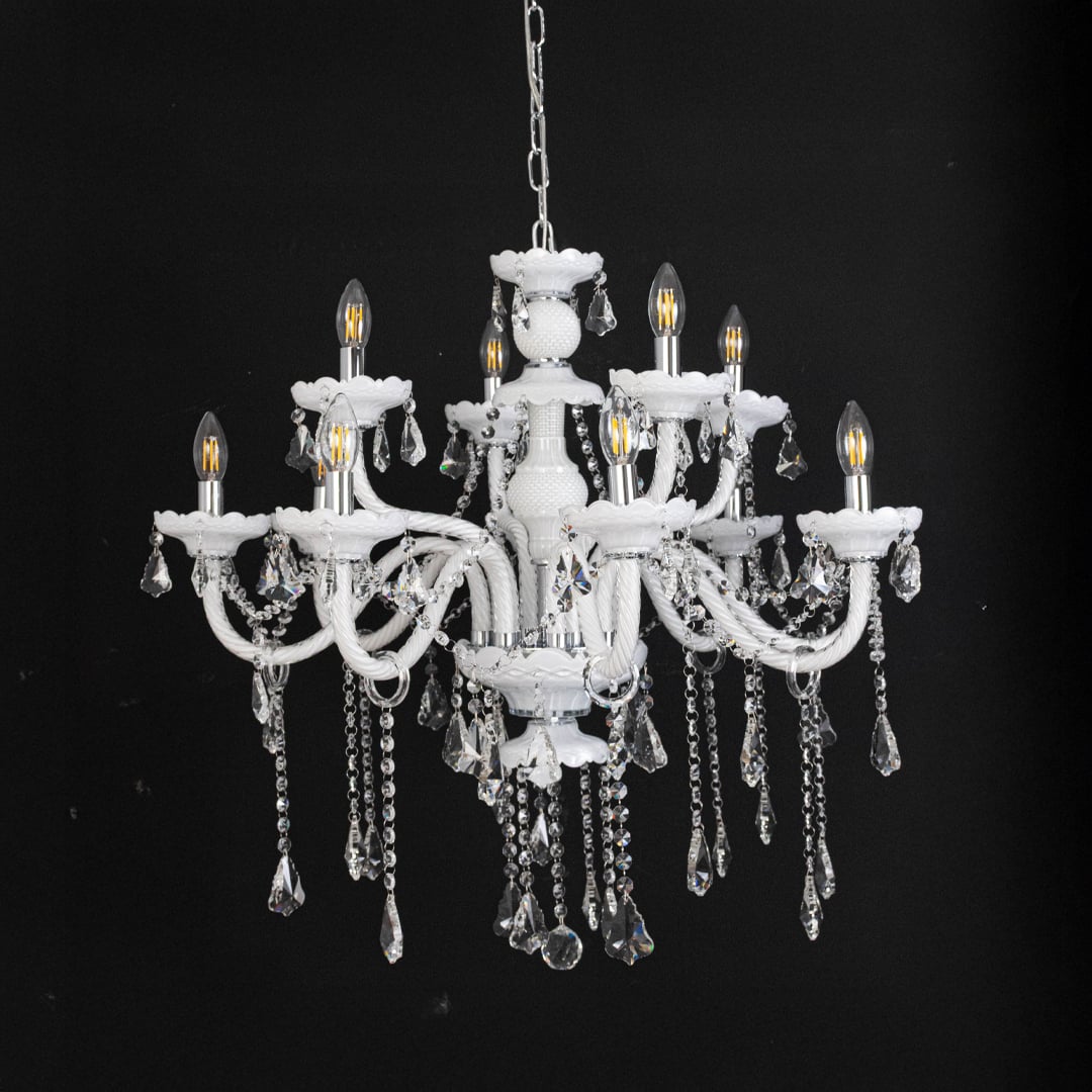 White chandelier with lights off featuring crystal beads and decorative glass body against black background.