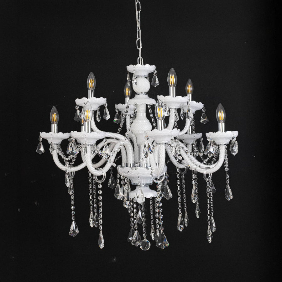 White chandelier with lights off featuring crystal beads and decorative glass body against black background.