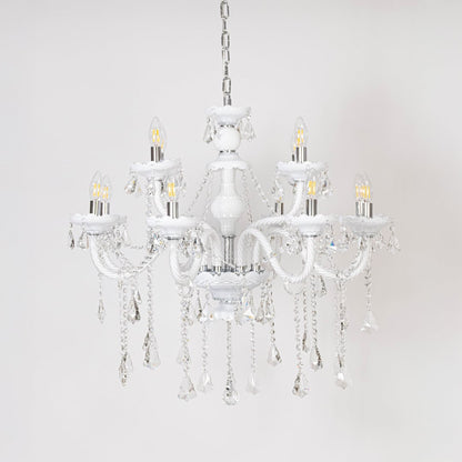 White chandelier with lights off showcasing crystal chains and glass arms photographed on plain white background.