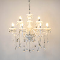 White crystal chandelier with illuminated candle bulbs and cascading crystal drops creating luxurious classic ceiling lighting.
