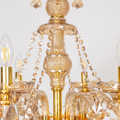 Closeup of crystal-chandelier detailing with hanging glass crystals and ornate design.