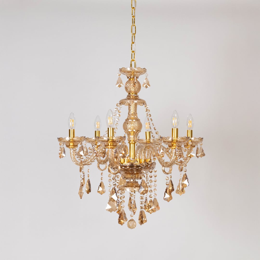 Crystal-chandelier decorative ceiling light turned off on white background.