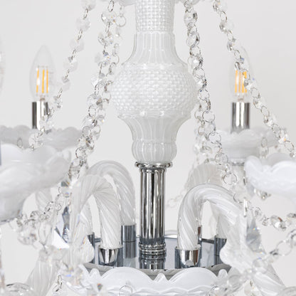 Closeup of chandelier showing crystal chains and candle lights with detailed craftsmanship for home ceiling decor.