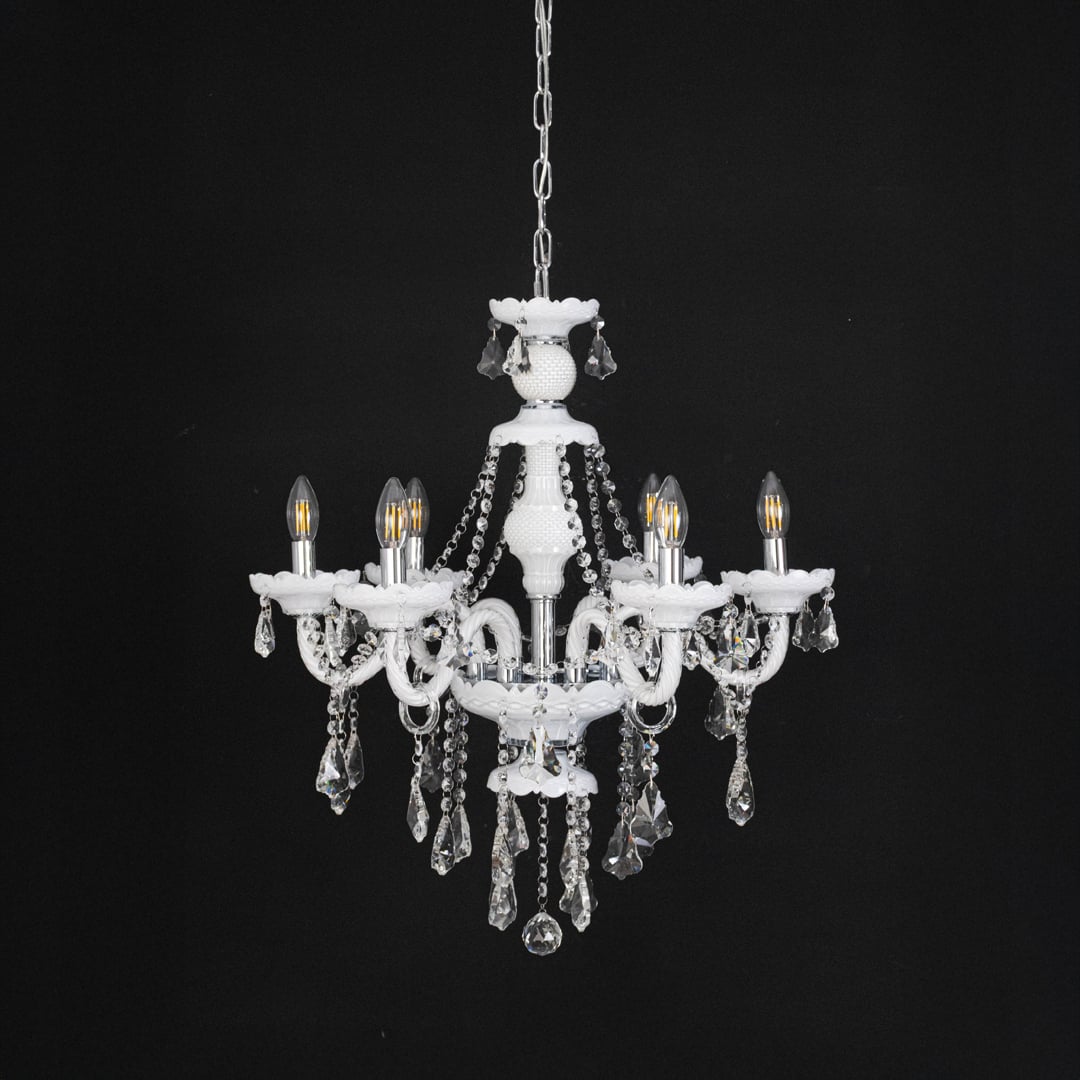 Chandelier with lights off highlighting glass and crystal design details photographed on black background.
