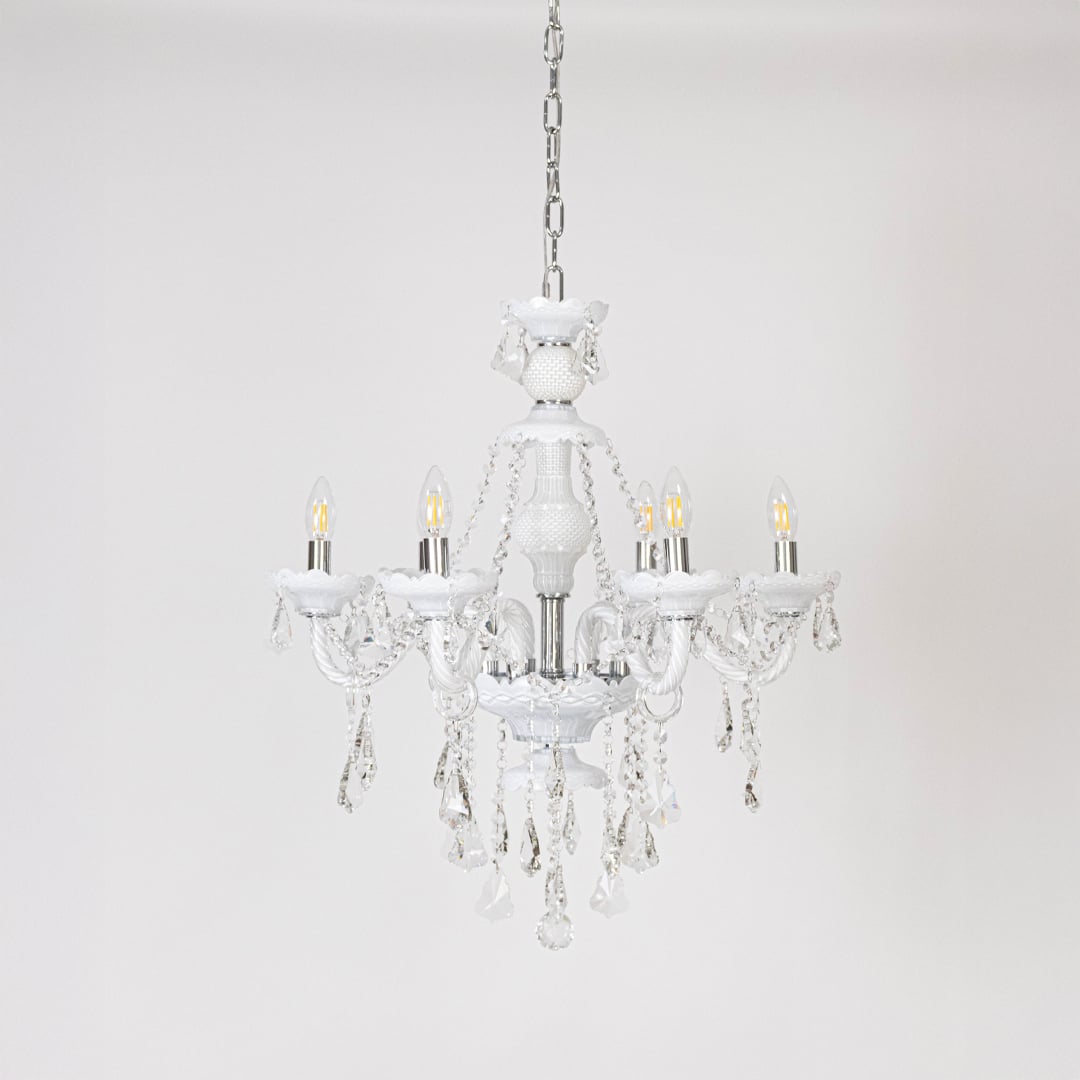 Chandelier with lights off showcasing crystal and glass frame design on plain white background for home interiors.