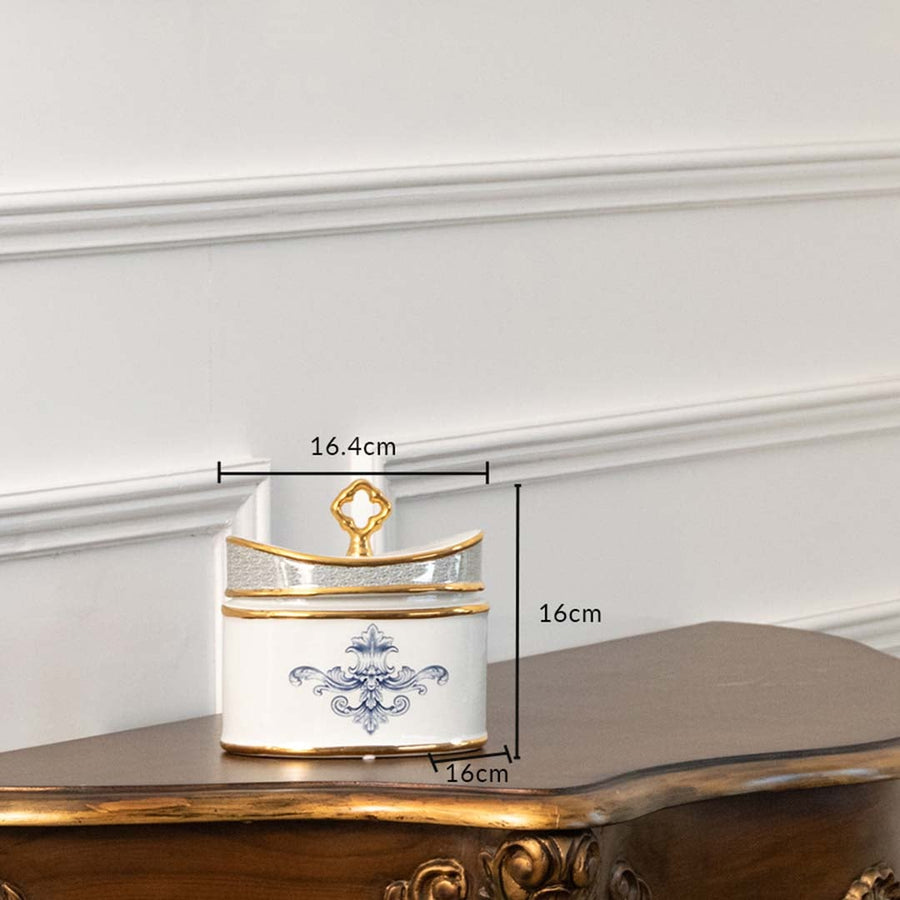 White ceramic jar with blue and gold artwork in a front view measuring 13.5 cm width and 10 cm height ideal for elegant décor styling.