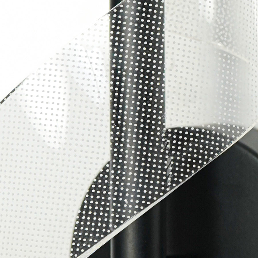 Closeup of black metal and translucent mesh wall light for premium modern decor styling spaces.