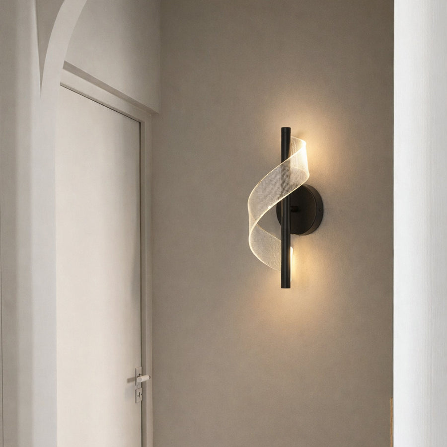 Modern gold metal wall light with warm ambient glow for elegant hallway and luxury decor spaces.

