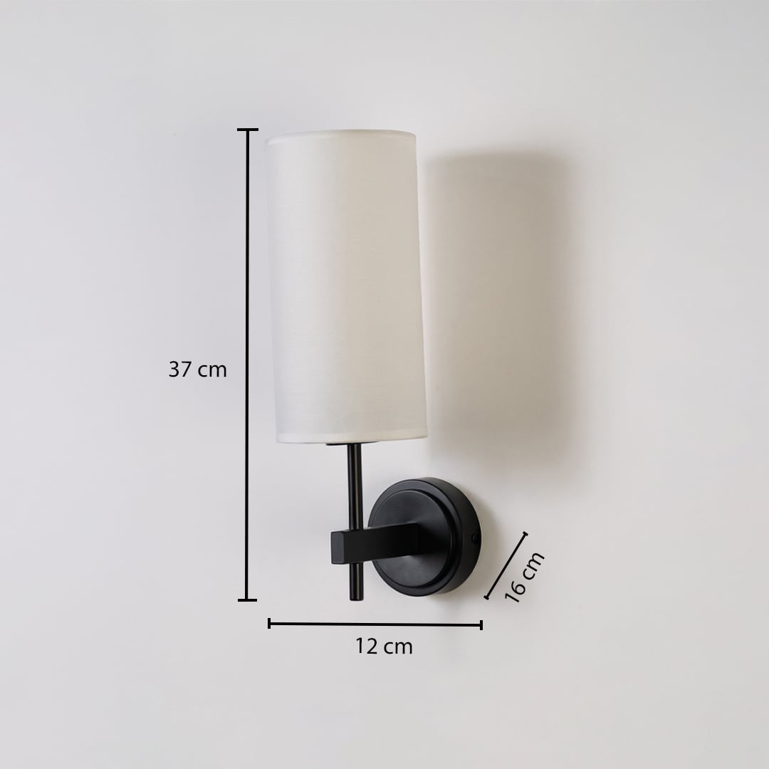 Black metal wall light with tall white fabric shade shown with 37 cm height 12 cm width and 16 cm depth for accurate indoor wall placement.