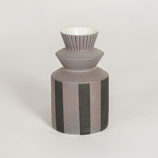 Erebus ceramic vase with striped textured body and sculpted neck isolated on clean white background for modern decor styling.