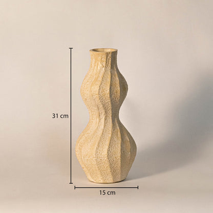 Textured wavy vase measuring 31 cm in height and 15 cm in width - perfect as a decorative accent or floral vase.