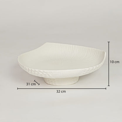 White ceramic pedestal fruit bowl with textured shell design showing 32 cm length 31 cm width and 10 cm height for dining table decor.