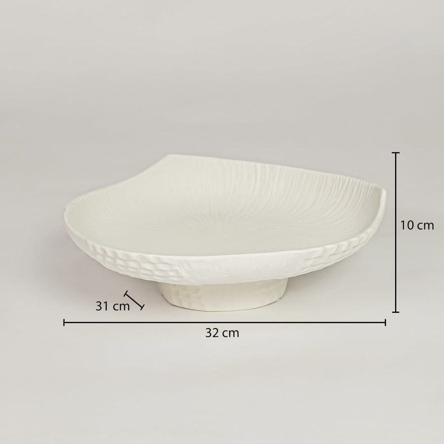 White ceramic pedestal fruit bowl with textured shell design showing 32 cm length 31 cm width and 10 cm height for dining table decor.