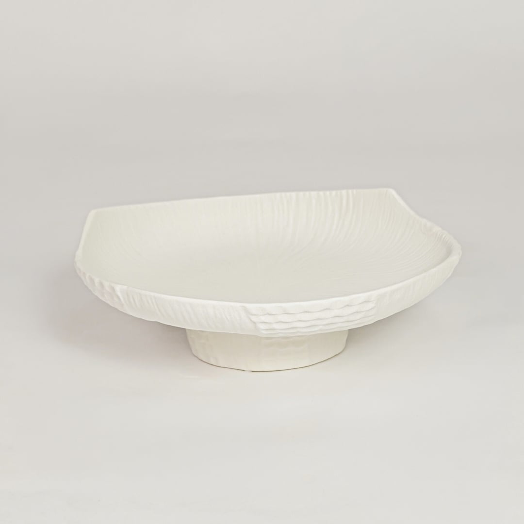 Modern white ceramic pedestal fruit bowl with sculpted texture perfect for dining table centerpiece kitchen counter styling and home decor.