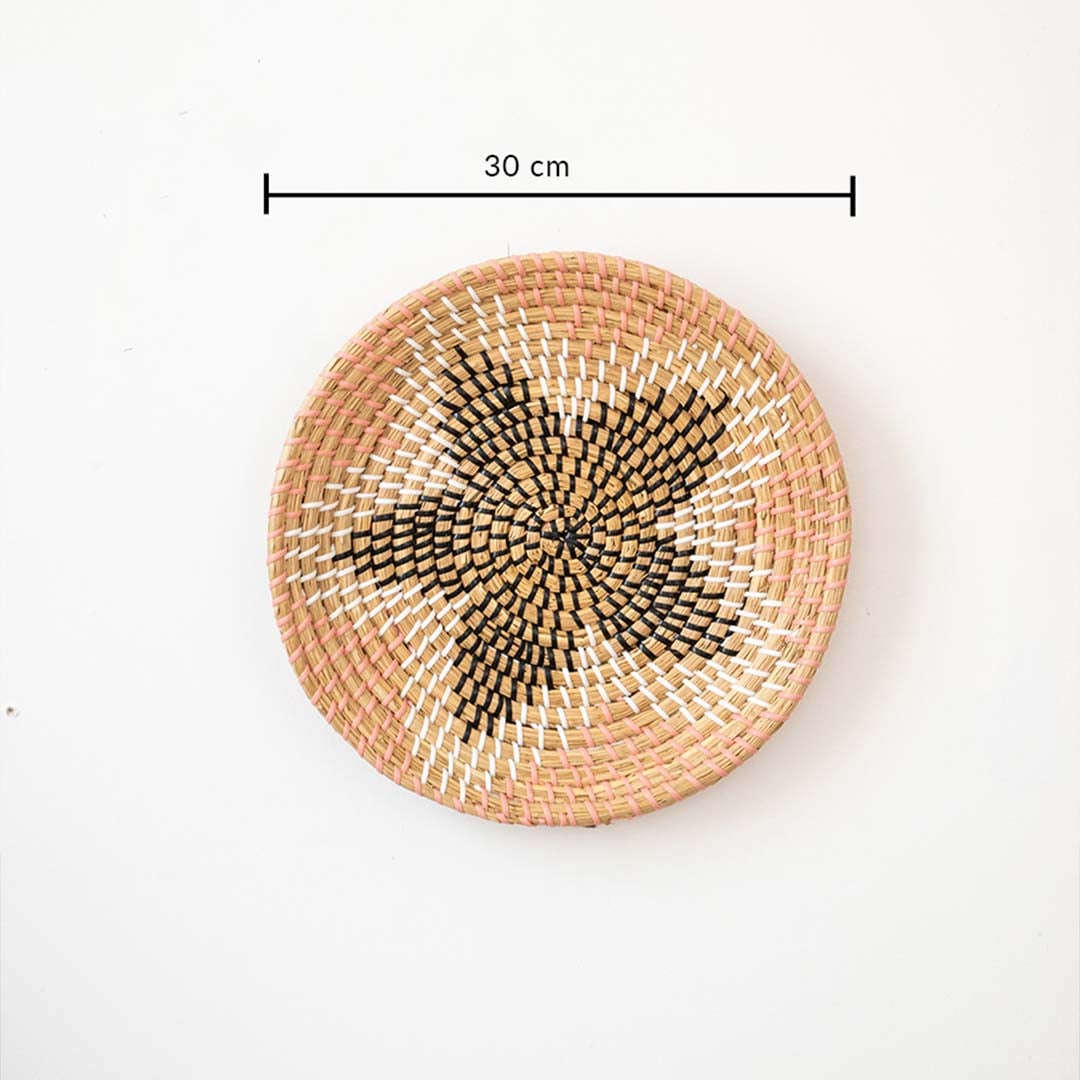 Decorative round wall basket with star pattern in peach and natural tones showing 20 cm diameter for compact wall styling.