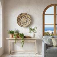 Natural woven wall basket gallery styled above a console for elegant bohemian wall decor and contemporary interiors.